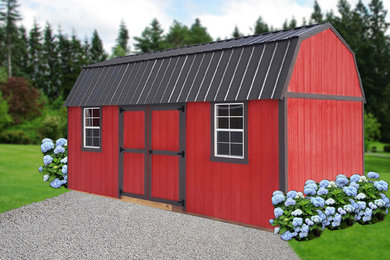 Example of a large classic red two-story wood exterior home design in Wilmington with a shed roof and a metal roof
