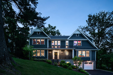 Example of a large transitional gray three-story mixed siding exterior home design in New York with a shingle roof