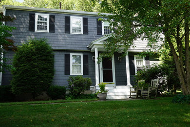 Example of a large classic gray two-story concrete fiberboard exterior home design in Boston with a shingle roof
