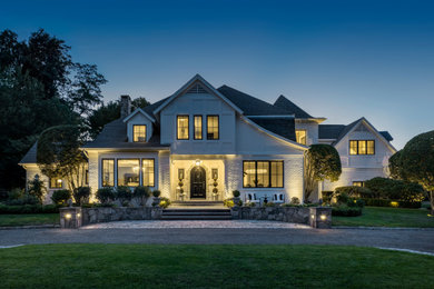 Huge transitional white two-story brick house exterior photo in Providence with a shingle roof