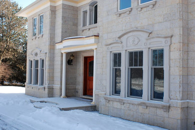 Example of a classic stone exterior home design in Chicago