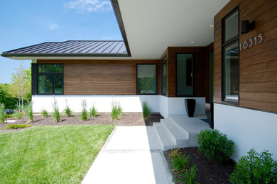Inspiration for a transitional white one-story stucco gable roof remodel in Kansas City