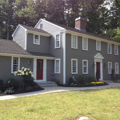 Large traditional gray two-story vinyl gable roof idea in Boston