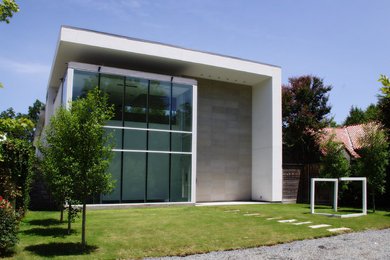 Example of a mid-sized minimalist white two-story exterior home design in Dallas