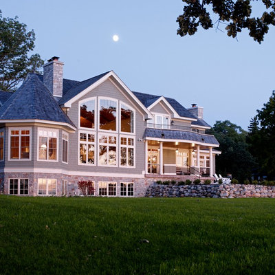 Example of a classic stone exterior home design in Chicago