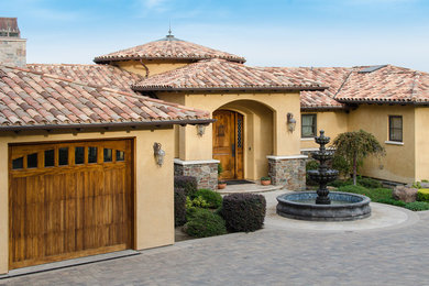 Example of a huge tuscan yellow stucco exterior home design in San Francisco