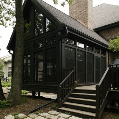 Inspiration for a large timeless brown one-story mixed siding exterior home remodel in Other with a shingle roof