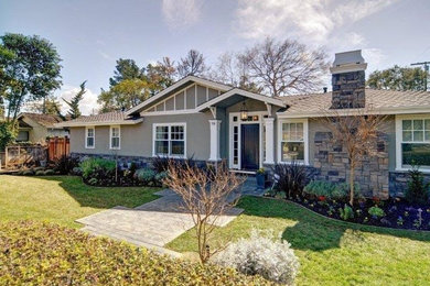 Example of a mid-sized classic gray one-story mixed siding house exterior design in San Francisco with a hip roof and a shingle roof