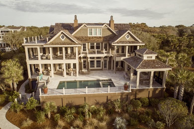 Example of a large arts and crafts exterior home design in Charleston