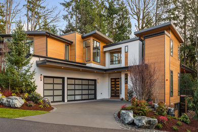 Inspiration for a contemporary multicolored two-story wood exterior home remodel in Seattle