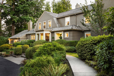 Large elegant gray two-story wood exterior home photo in Portland