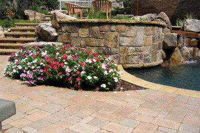 Retaining wall, Waterfall, Steps, Paver terrace and Pool coping