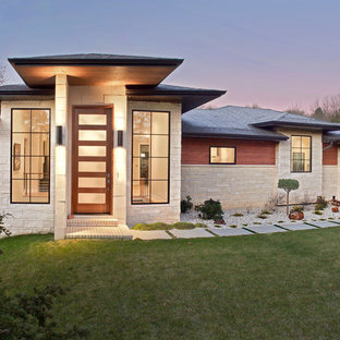 Inspiration for an asian one-storey beige house exterior in Other with mixed siding, a hip roof and a shingle roof.