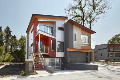 Contemporary two-story stucco exterior home idea in Edmonton