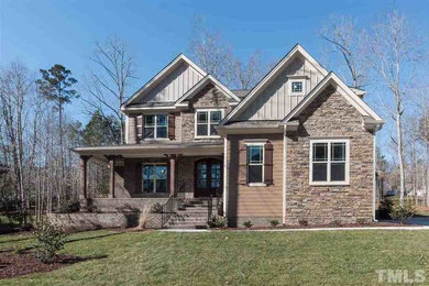 Inspiration for a large craftsman brown two-story stone exterior home remodel in Raleigh