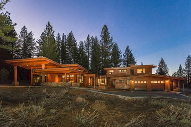 Inspiration for a large contemporary brown two-story wood house exterior remodel in Sacramento with a hip roof