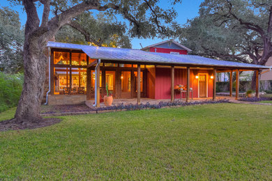 Example of a mid-sized arts and crafts exterior home design in Austin