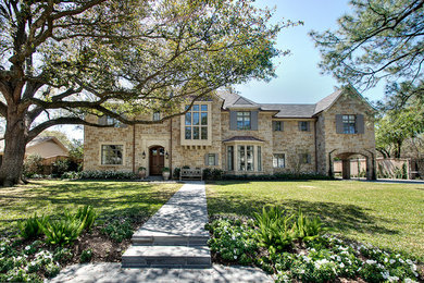 Traditional stone exterior home idea in Houston