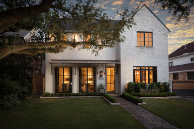 Example of a large transitional white two-story exterior home design in Houston