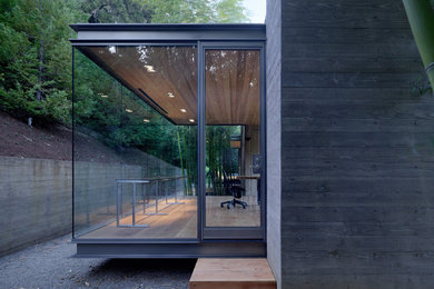 Small modern bungalow concrete house exterior in San Francisco with a flat roof.