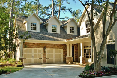 Example of a large classic brown two-story stone exterior home design in Houston