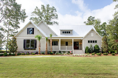 Coastal white two-story exterior home idea in Charleston