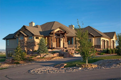 Huge mountain style beige one-story mixed siding exterior home photo in New York