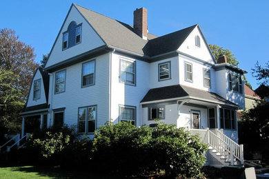 Large traditional white three-story vinyl exterior home idea in Boston with a shingle roof