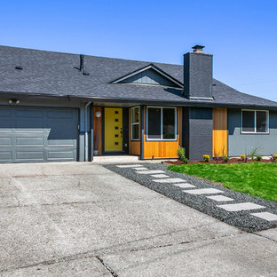 Inspiration for a large midcentury exterior in Seattle.