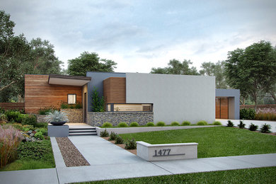 Example of a mid-sized minimalist gray one-story stucco flat roof design in Boise