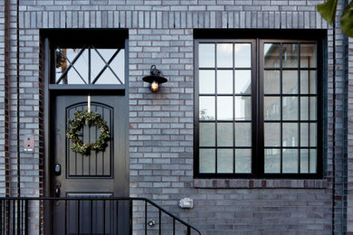 Photo of a black traditional brick house exterior in Baltimore.