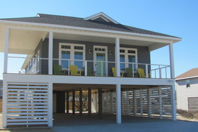 Example of a small one-story vinyl exterior home design in Other