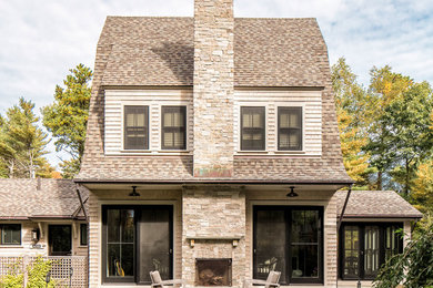 Elegant three-story wood house exterior photo in Portland Maine with a gambrel roof and a shingle roof