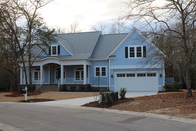 Mid-sized transitional blue two-story wood exterior home idea in Wilmington with a shingle roof