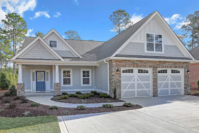 Mid-sized transitional blue two-story concrete fiberboard exterior home idea in Wilmington with a shingle roof