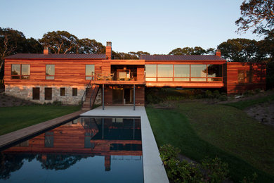 Inspiration for a large contemporary brown two-story wood exterior home remodel in Boston