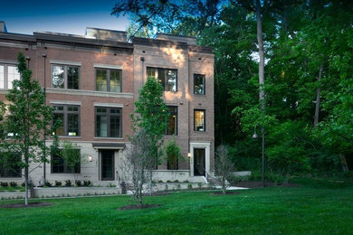 Large trendy beige three-story exterior home photo in DC Metro
