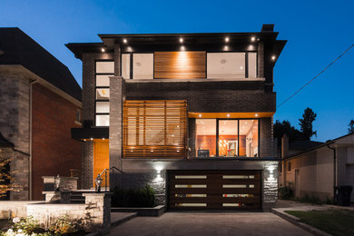 Example of a mid-sized minimalist exterior home design