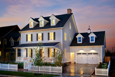 This is an example of a white traditional two floor house exterior in Denver.