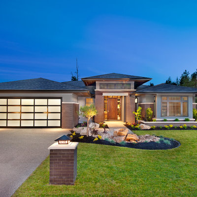 Trendy brick exterior home photo in Vancouver