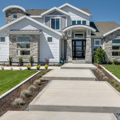 Large arts and crafts white two-story mixed siding exterior home photo in Salt Lake City with a shingle roof