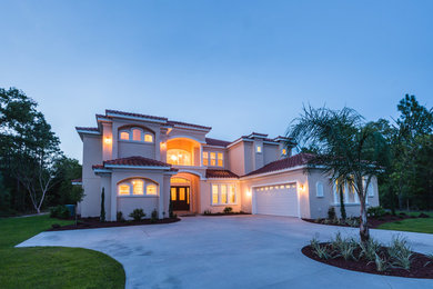 Example of a tuscan exterior home design in Orlando
