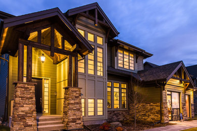 Inspiration for a large craftsman green two-story concrete fiberboard exterior home remodel in Calgary