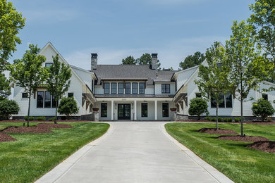 Huge country white two-story wood townhouse exterior idea in Raleigh