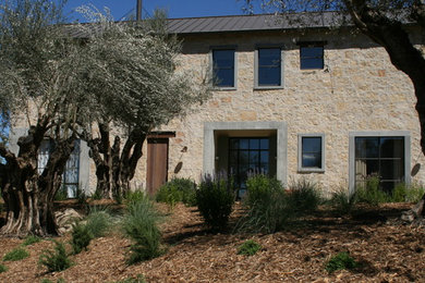The front of house with ancient olive trees
