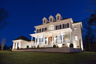 Inspiration for a timeless white two-story vinyl house exterior remodel in Charlotte