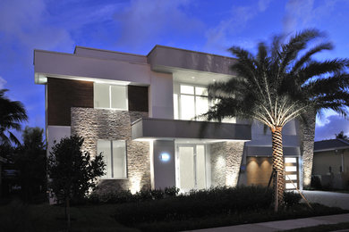 Mid-sized contemporary white two-story mixed siding exterior home idea in Miami
