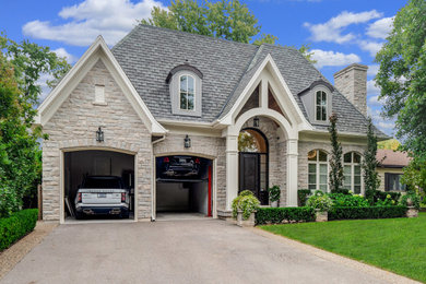 Example of a transitional gray house exterior design in Toronto
