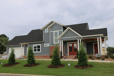 Inspiration for a mid-sized transitional gray two-story concrete fiberboard gable roof remodel in Little Rock
