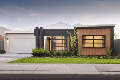 Contemporary bungalow house exterior in Other.